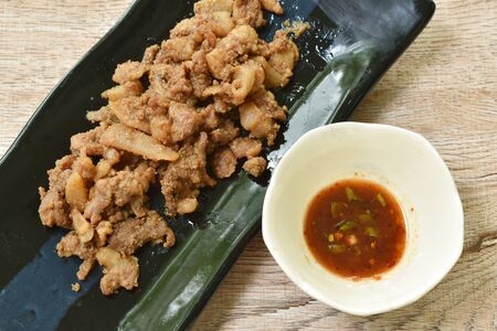 steamed slice pork with belly on plate dipping spicy sauceの写真素材