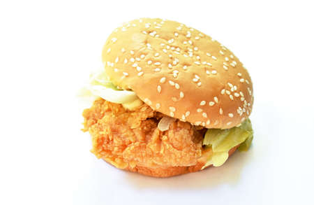 crispy fried chicken hamburger dressing cheese sauce on white backgroundの写真素材