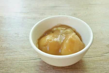 mashed potato dressing gravy sauce in cup on tableの写真素材