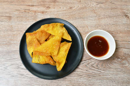 crispy fried dumpling paste dipping sweet chili sauce on plate