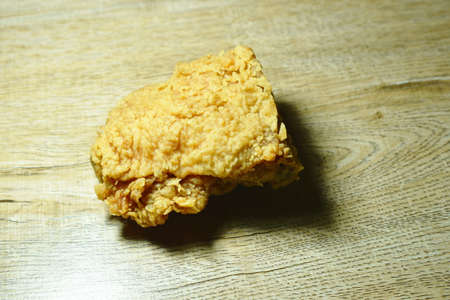crispy fried chicken tight on table backgroundの写真素材