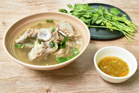 boiled pork bone with Chinese celery soup dipping spicy chili sauceの写真素材