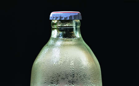 soda carbonate water with bubble floating in glass bottleの写真素材