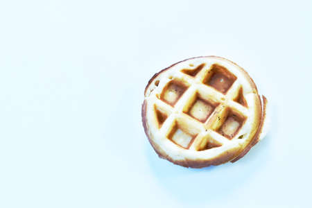 baked circle butter waffle with raisin on plateの写真素材