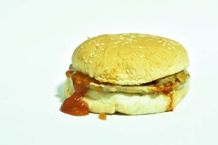 pork and bacon hamburger with cheese dressing ketchup on white backgroundの写真素材