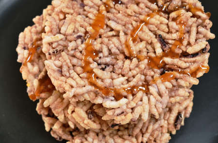 Thai sweet dessert crispy rice cracker with sugar cane baking watermelon juice dressing caramel on...