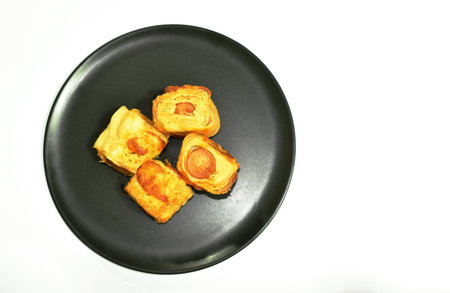 crispy bread stuffed slice smoked pork sausage on plateの写真素材