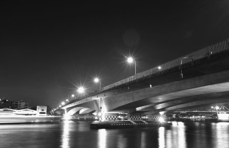 landscape of Phra Pok Klao memorial bridge cross river in Thailand cn nightの写真素材