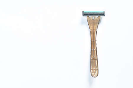 green plastic shaver arranging on white background