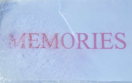 red memories letter on white paper freezing in ice background and textureの写真素材