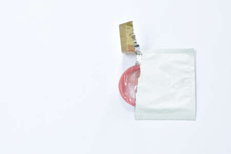 condom out from package prepare to used on white backgroundの写真素材