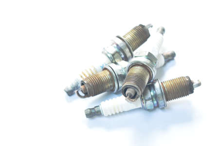 old car spark plug arranging on white background