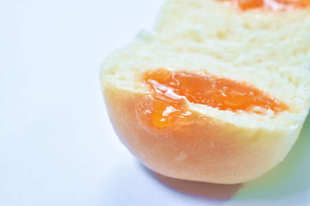 bread stuffed orange custard arranging on white background