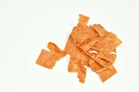 baked slice crispy pork Thai salty snack on white backgroundの写真素材