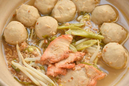 boiled barbecue pork and meatball topping slice yard long bean and bean sprout called Thai Sukhothai...