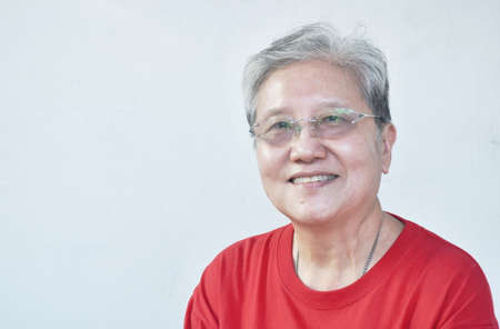 Asian elder woman face portrait on white backgroundの写真素材