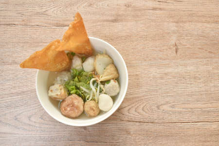 boiled Hakka meatball made from chop pork stuffing fried tofu with bean sprout and lettuce in soup on bowlの写真素材