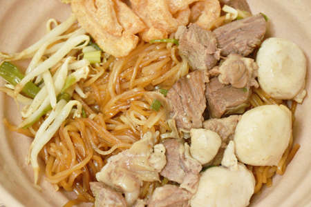 boiled dry thin rice noodles topping slice braised pork and meatball dressing sweet black soybean...