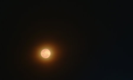 full moon on dark sky in nightの写真素材