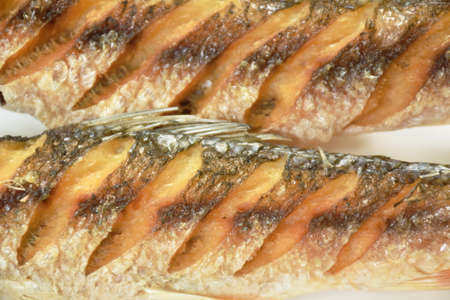 deep fried salty mullet fish arranging on plate