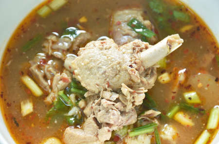 hot and spicy duck meat with tamarind and Thai herbs soup on bowl