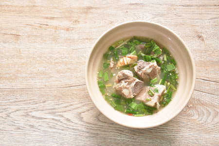 hot and spicy pork bone with tamarind and Thai herbs soup on bowlの写真素材