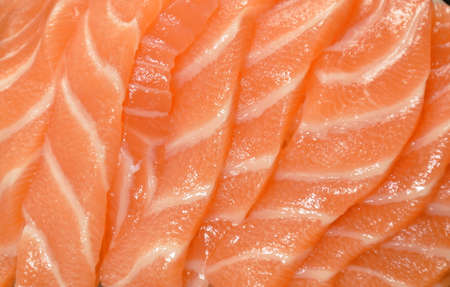 fresh slice salmon sashimi Japanese food topping chop rasish dressing wasabi and shoyu soy sauce on plateの写真素材