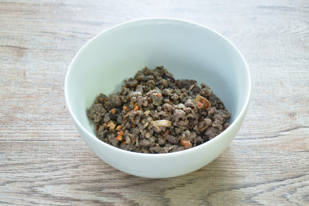 stir fried chop pork with Chinese black olive on bowlの写真素材