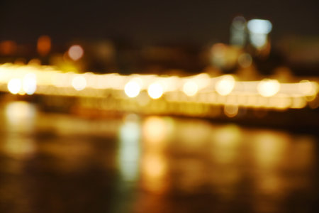 blurry artificial light on river background and texture in nightの写真素材
