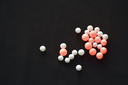 colorful foam seed for absorb delivery stuff arranging on black backgroundの写真素材