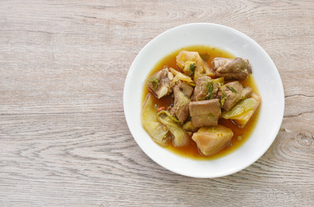 boiled braised pork bone with pickled cabbage stew on plateの写真素材