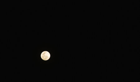 bright moon floating on sky in night backgroundの写真素材