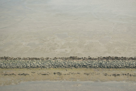 sea flowing and hit to rock for protection beach in Thailand