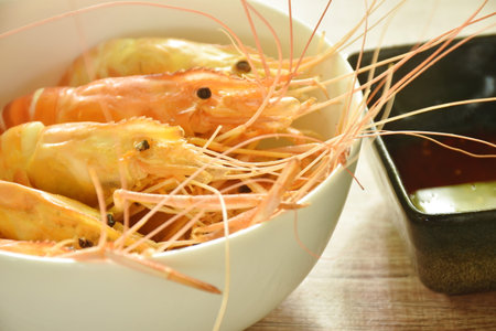 baking sat river shrimp arranging on bowl dipping spicy sauceの写真素材