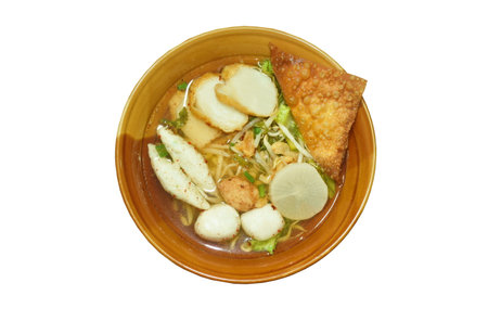 boiled meatball made fish and shrimp with bean sprout and lettuce in spicy soup on bowl