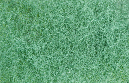 close up of green scrub sponge background and textureの写真素材