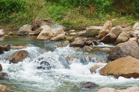 water falling on river pass rock and stone at Kho Chong Lom waterfall in Thailand