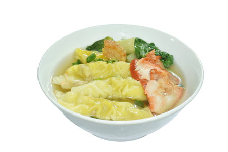 Chinese dumpling topping slice red barbecue pork with clear soup on bowl