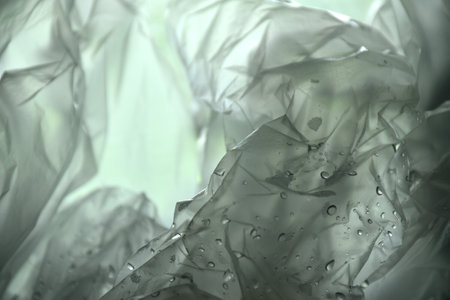 white plastic bag packing stacking with drop of water background and texture