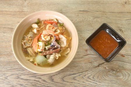boiled sukiyaki seafood chicken and pork meat couple crispy pickled squid and shrimp with vegetable...