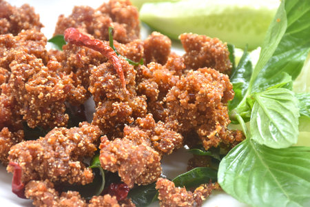 deep fried spicy mashed pork salad eat couple with fresh vegetable on plateの写真素材