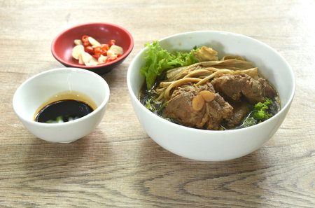 Bak Kut Teh boiled braised pork bone with mushroom in Chinese herb brown soup on bowlの写真素材