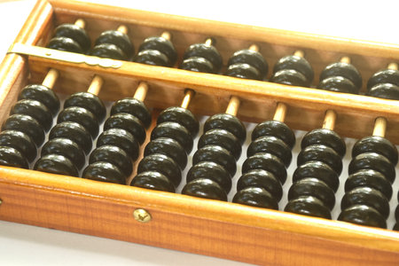 wooden abacus old Chinese tool for calcuated arraning on white backgroundの写真素材