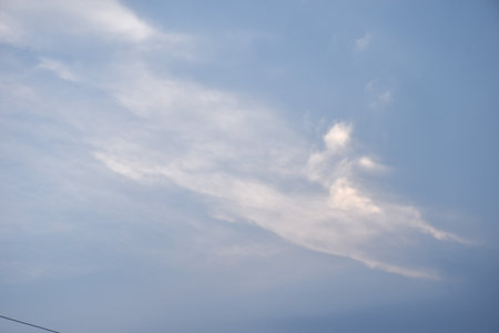 white and dark cloud floating on sky in eveningの写真素材