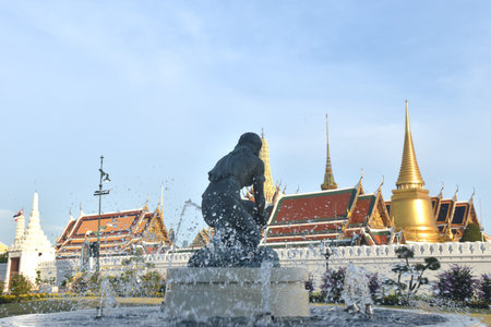 fountain in front of temple of emerald Buddha or wat Phra Kaew travel location and landmark in Thailand in sunsetの写真素材