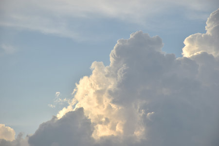 white and dark rain cloud floating on sky in eveningの写真素材