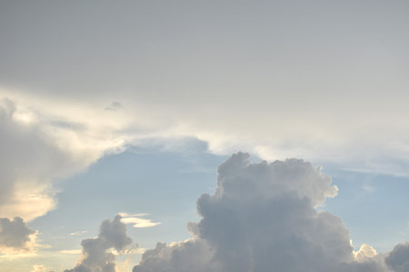 white and dark rain cloud floating on sky in eveningの写真素材