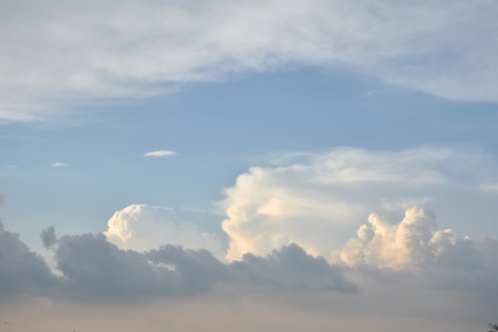 white and dark rain cloud floating on sky in eveningの写真素材