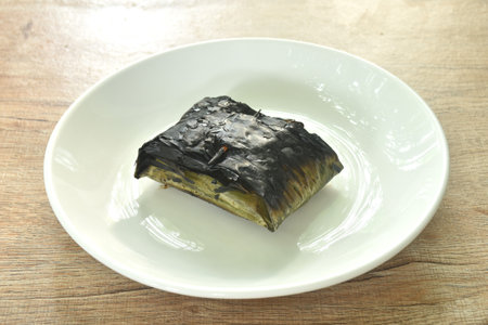 grilled chop pork curry in banana leave Thai northern food on plateの写真素材