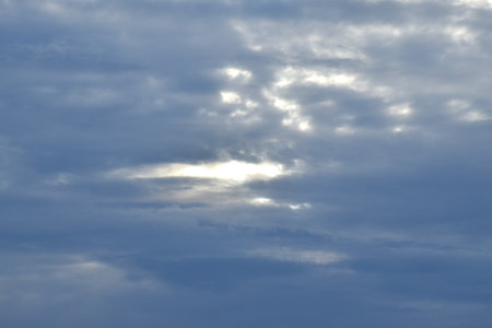dark rain cloud floating on sky at sunset in eveningの写真素材